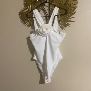 Elegant White One-Piece Swimsuit with Floral Accent
